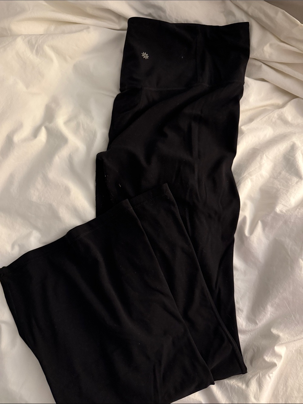 Athleta Black Flare Leggings with Subtle Logo